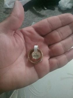 round silver-colored pendant