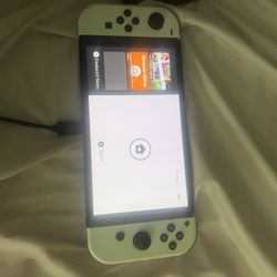 Nintendo Switch – OLED Model w/ White Joy-Con