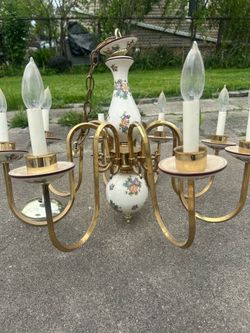 vintage Italian Capodimonte style chandelier featuring porcelain floral details and brass arms.