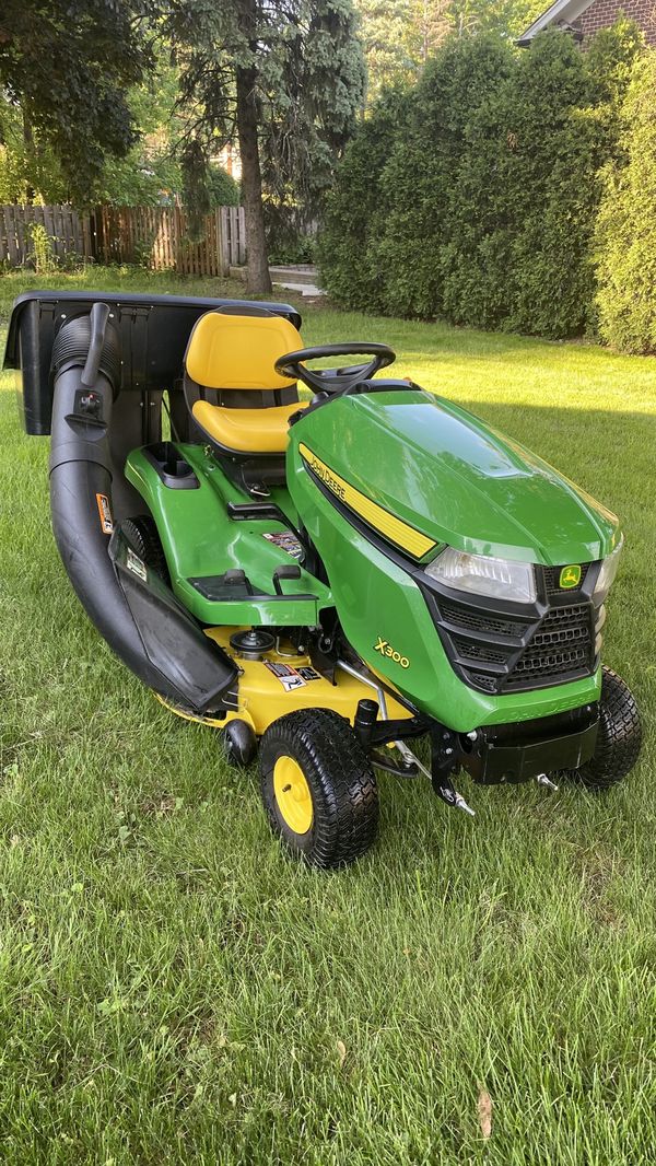John Deere , riding mower X300 , 42” deck , 100 hours, bagger system