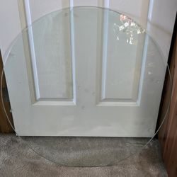 Circular quarter inches glass table cover.