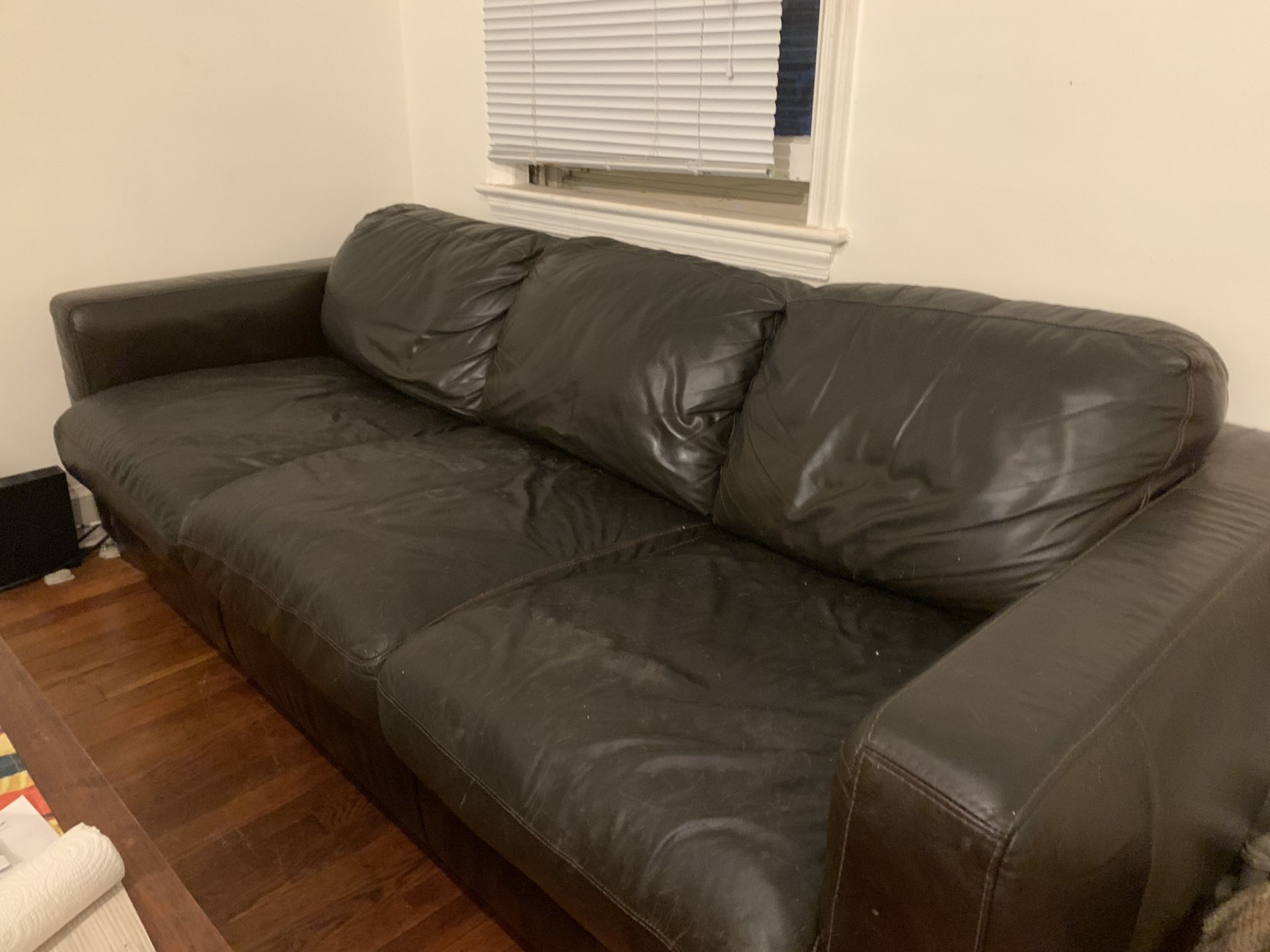 Super comfy black leather couch with matching footrest