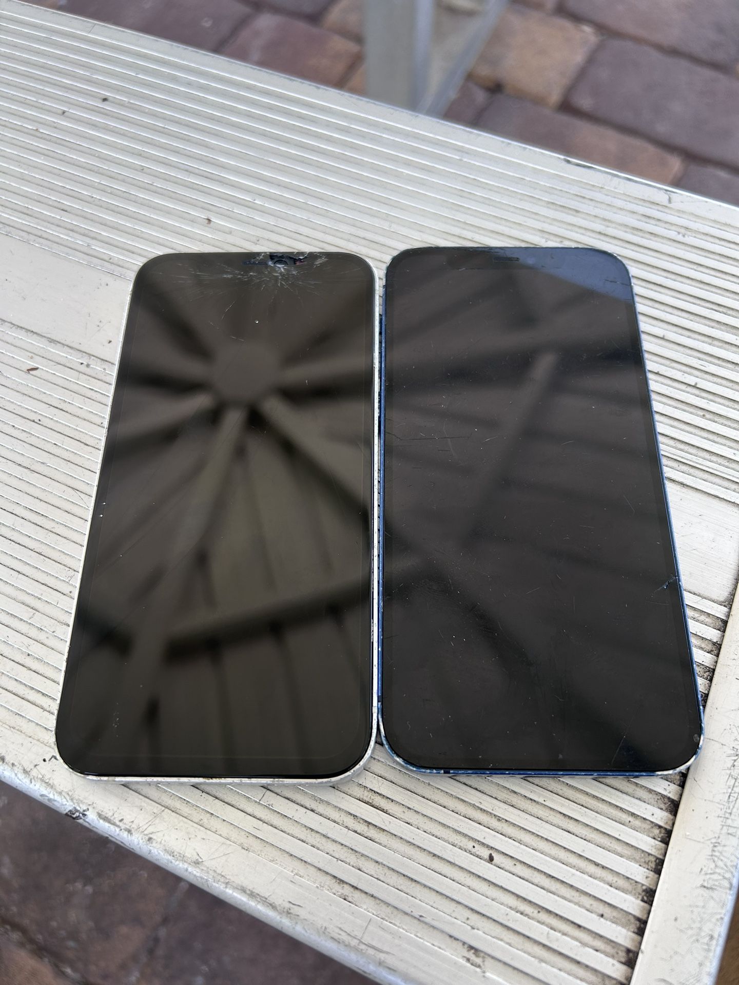 2 iPhone 12 With Crack Screens and Password Lock