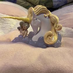 Cute Girl With Unicorn Figure