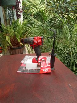 Milwaukee 18 v new fuel. Hammer drill.  1/2".  2 speed.  W/ handle