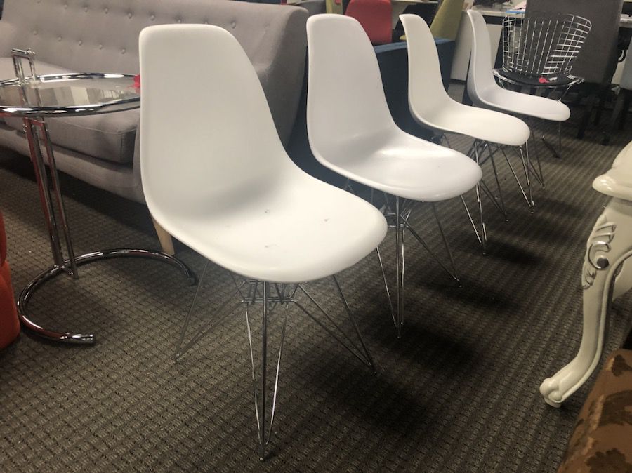Set of 4 white eames style dining chairs with scratches