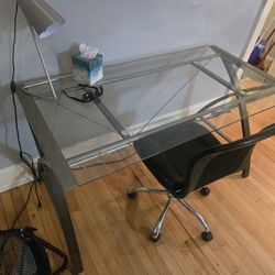 Glass Desk And Silver Lamp