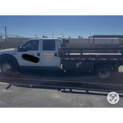 2007 F550 4x4  crew cab with 12’ flatbed