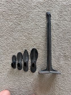 old cast-iron cobbler/shoemaker’s repair stand with four interchangeable shoe lasts.