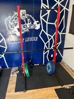 Squat Rack with bar and weights.