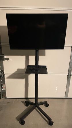 32” TCL tv and rolling stand