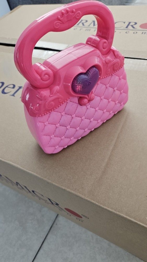 Cartera con luces,guitarra,walkie talkie,caballos Frozzen y Spirit