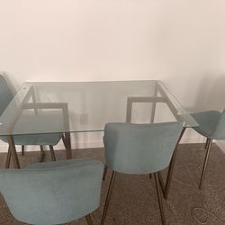 Glass table with chairs
