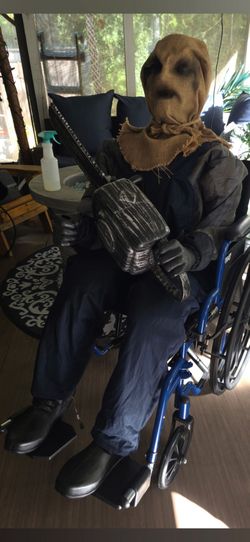 Animated Seated Chainsaw Greeter Scarecrow with Sound Halloween Decoration -