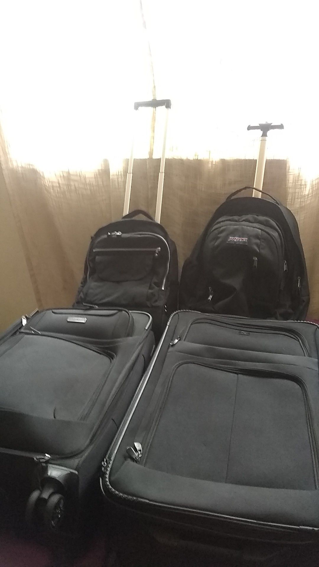 Two suitcases and 2 carrying bags