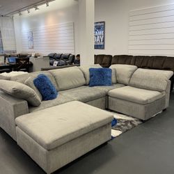 Going Out Of business sale. Lima gray sectional sofa with ottoman set now $899. Easy finance option. Same day delivery.
