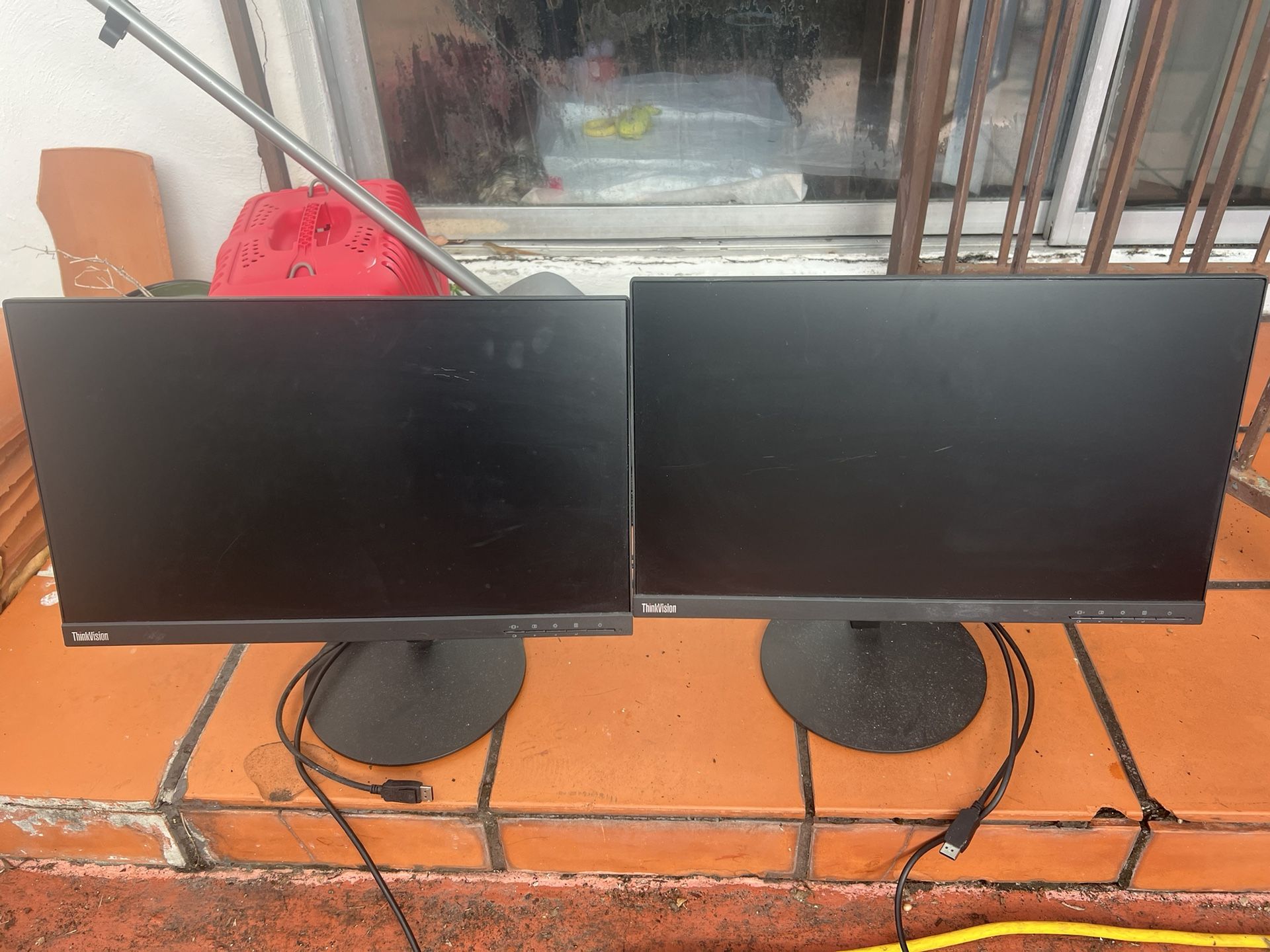 2 Lenovo Think vision Monitors