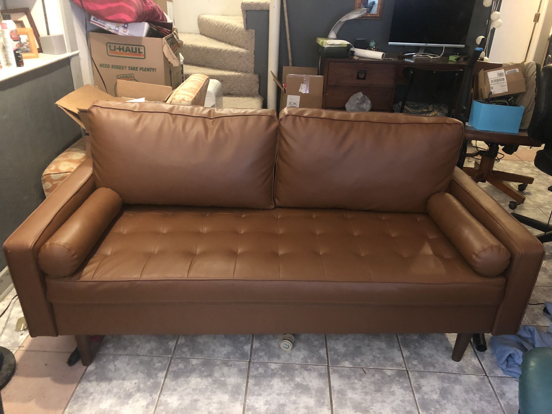 Brown, modern (faux) leather couch