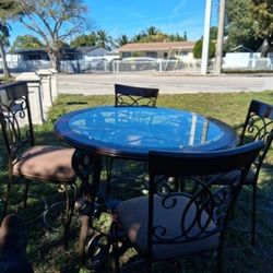 Brown wood dinning room table and chairs
