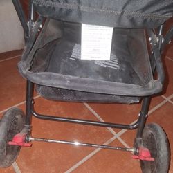 Used Kolcraft Cloud Sport Lightweight Stroller in a pink and gray color scheme.