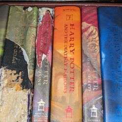Complete Set Of Hardback Harry Potter Books By J.K. Rowling About Hogwarts School. These don't look read, but a few have damage, mainly last 3, name w