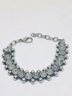 Silver tone bracelet with original design