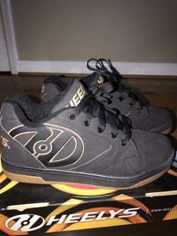 Brown and black heelys size 6y “used”