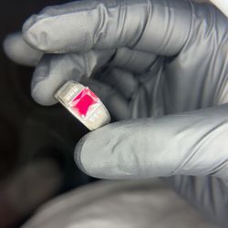 a handcrafted sterling silver ring for men featuring a red gemstone,