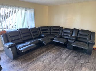 Black leather reclining sectional couch - 3 sections