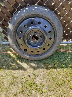 (GENTLY USED) 16" CHEVY IMPALA STEEL SPARE TIRE, ASKING $60