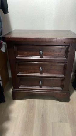 Plug in nightstand with outlet in top draw