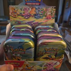 Lot of Pokémon mini tins with eevee coin and art card