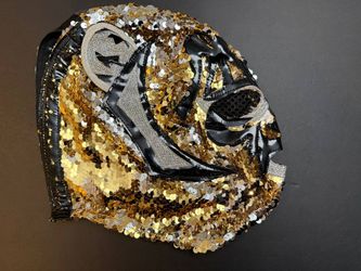Wrestler's mask in the shape of a lion's head, gold and silver, with ears 