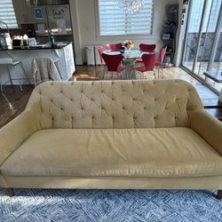 West Elm Tillary Tufted Sofa, 84” wide, in gold velvet upholstery.