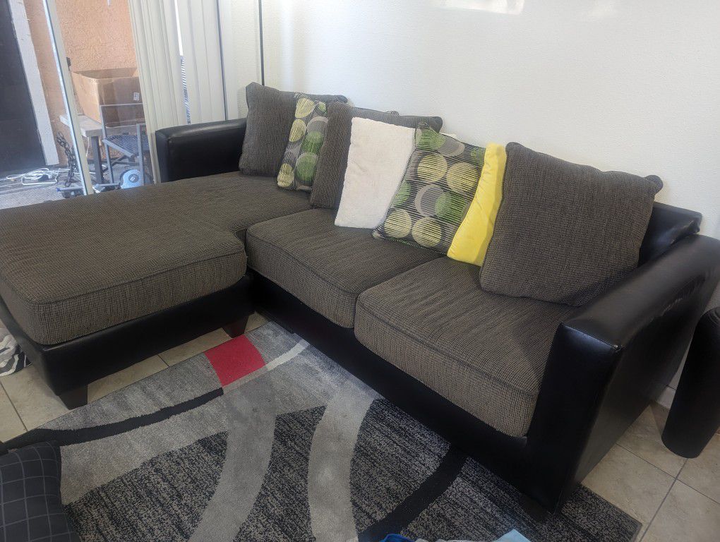 Left Facing Sectional. Gray With Pillows