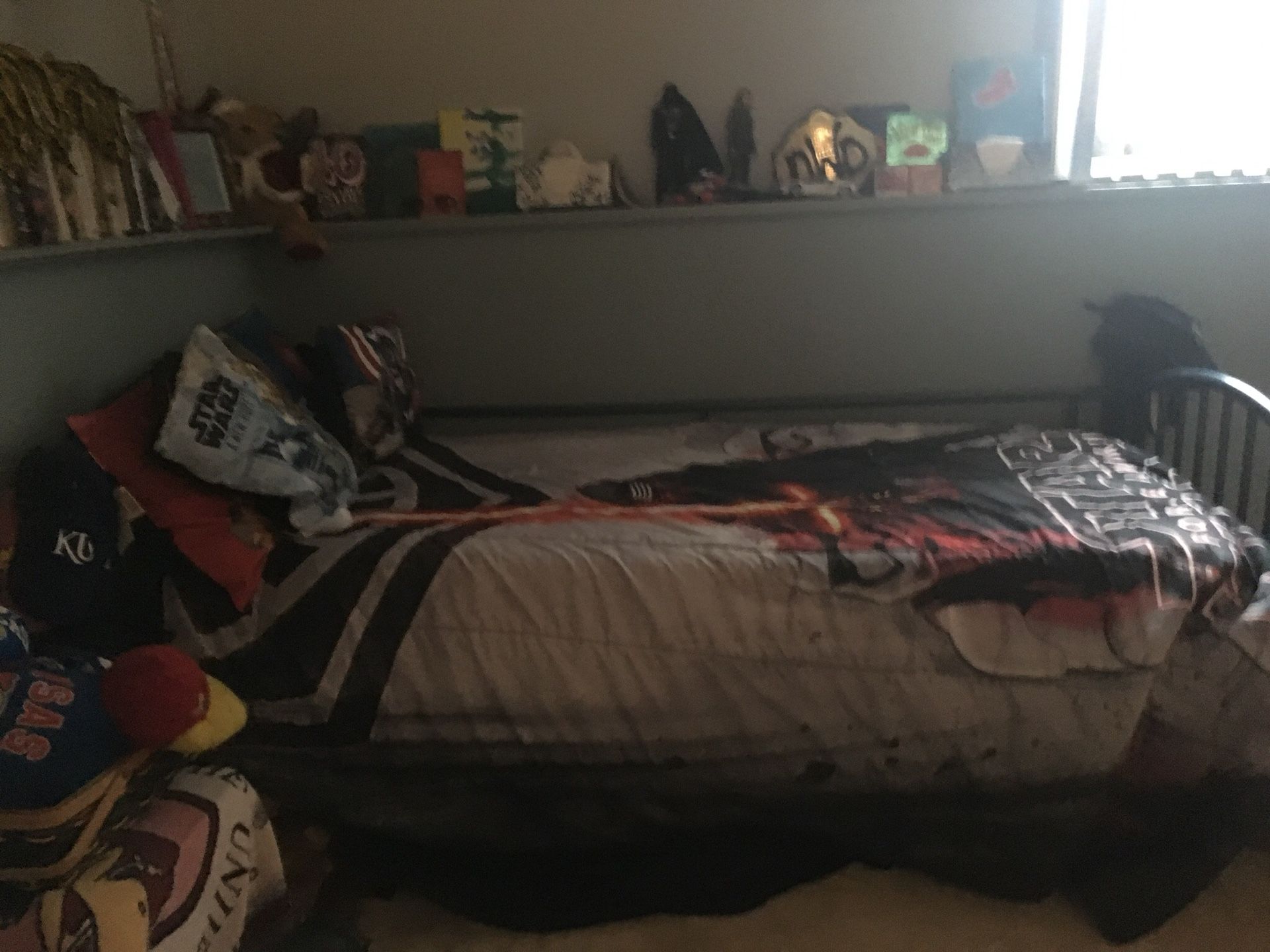 Star Wars Twin Bed Set with a black fitted and black regular sheet. Reversible Star Wars comforter, along with two Star Wars pillow shams. Also inclu