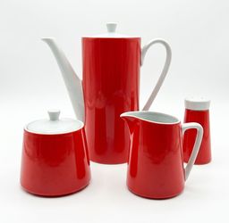 NY: Vintage red and white tea set with a salt shaker.