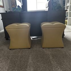 2 yellow nailhead ottomans