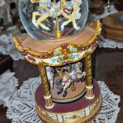 This is a San Francisco Music Box Company Carousel Revolving Musical Water Globe. 