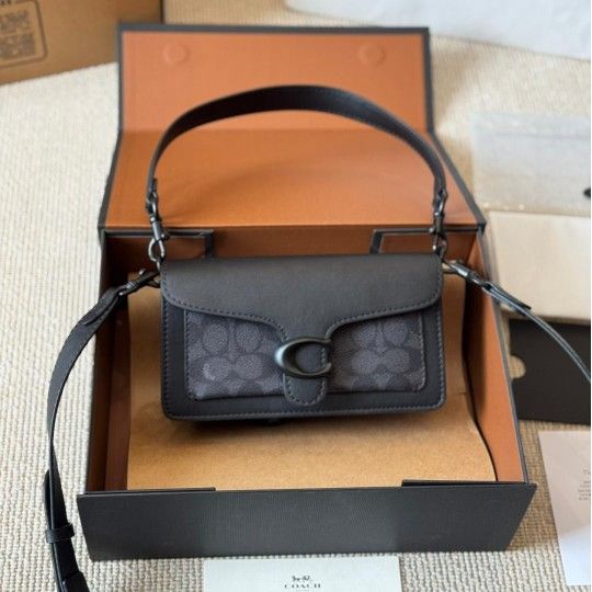 Women's black hand-held shoulder crossbody bag