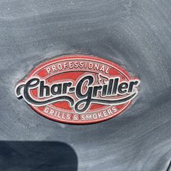 Char-Grille Barrel  BBQ, Grilling Tools, And A Bag Of Charcoal