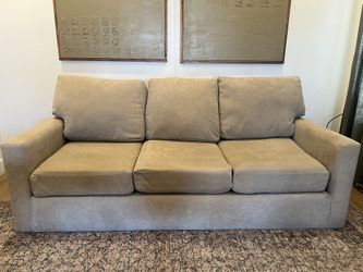Tan Living Spaces Couch With Queen size pullout Bed