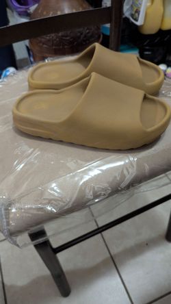 Yeezy slides size 11 women & 9.5 men