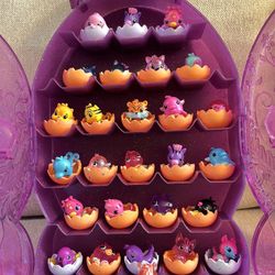 Like New , Hatchimals COLLEGGTIBLES , Lot of 27 Figures with Purple Glitter Case