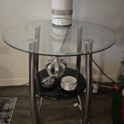 Two glass end tables