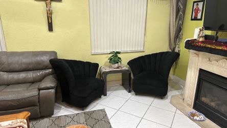2 chairs with small tables