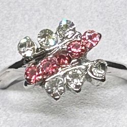 This beautifully simple ring is sure to catch eyes with its stunning red and clear stones. The silver tone finish adds a touch of elegance to the piec