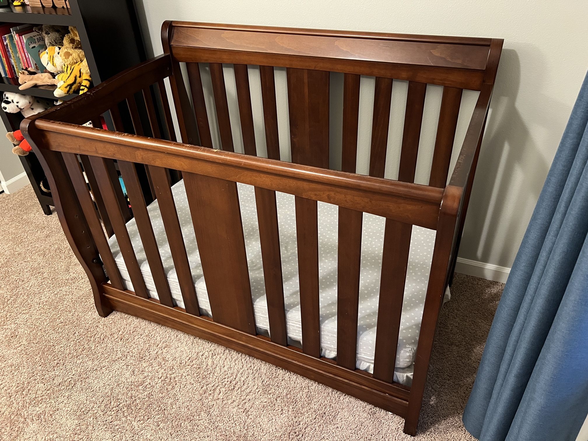 Convertible crib/toddler bed, foam mattress, and bedding. 