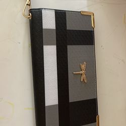 Black silver, gold￼ and white wallet