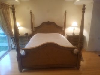 King sized bed set with marble top side drawers and lamps